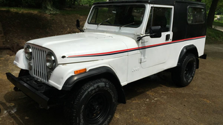 For $8,450, This 1984 Jeep CJ8 Scrambler Could Let You Go Postal<em></em>